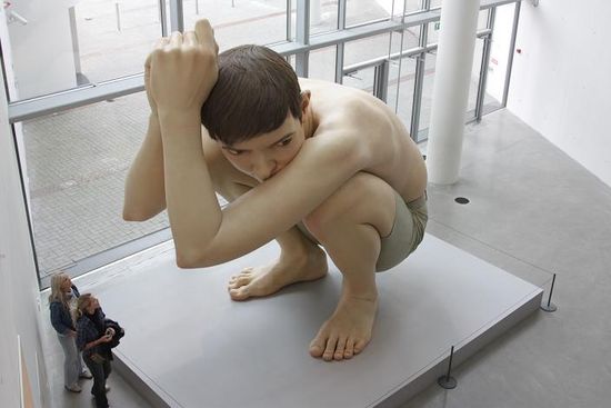 huge boy crouching sculpture ultra realistic art ron mueck 35 Sculptures That Will Make You Look Tiny
